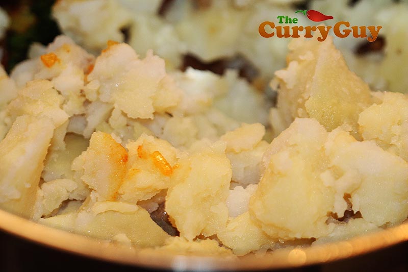 Making potato curry
